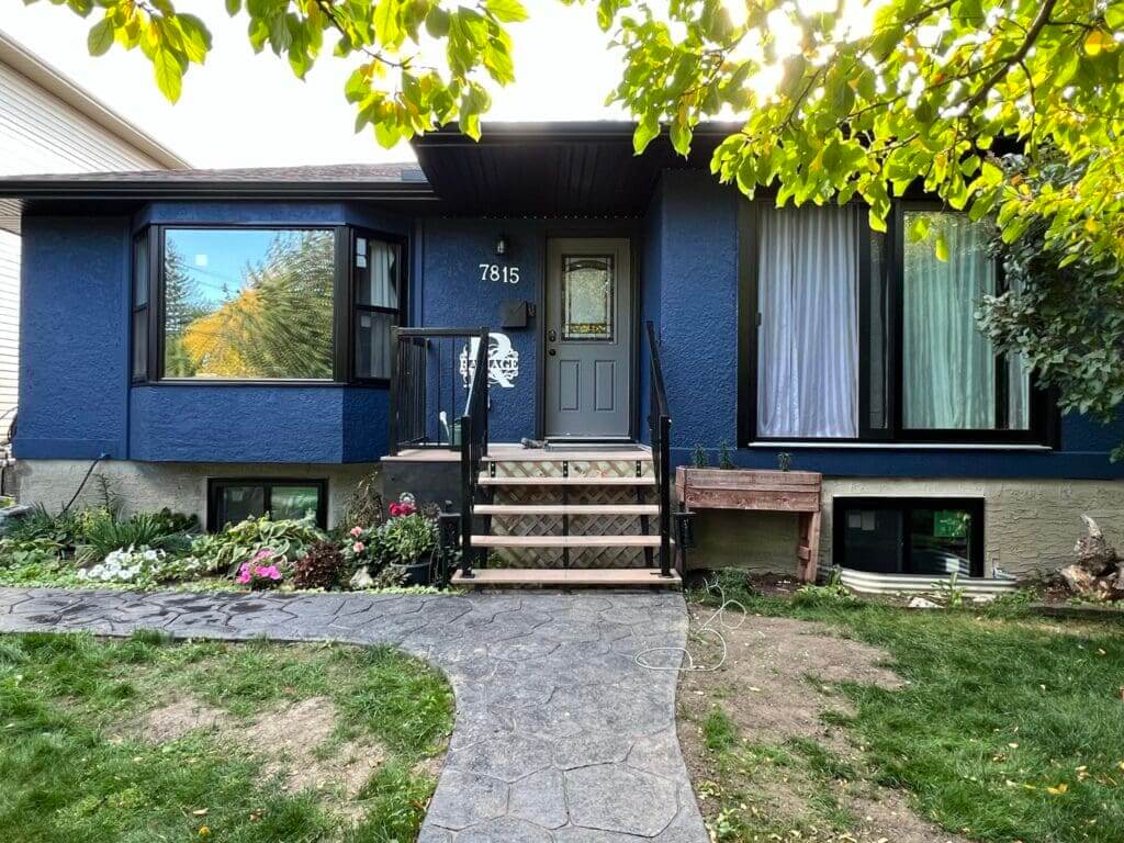 Repair and paint blue house with popcorn dash stucco