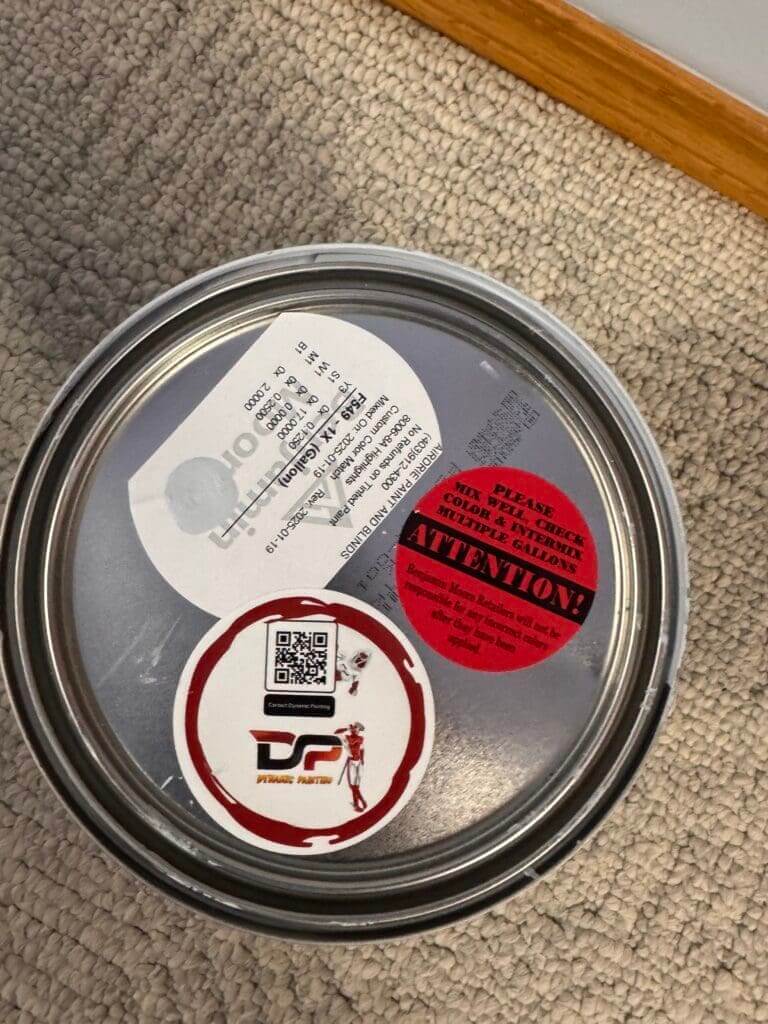A Dynamic painting logo on regal paint can with a qr code leading to dynamics contact information.
